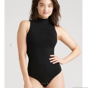 tight black turtle neck bodysuit